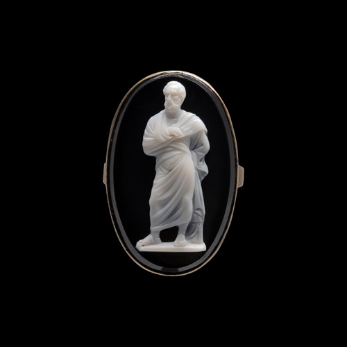 A Neoclassical onyx cameo set in a gold ring. Demosthenes.